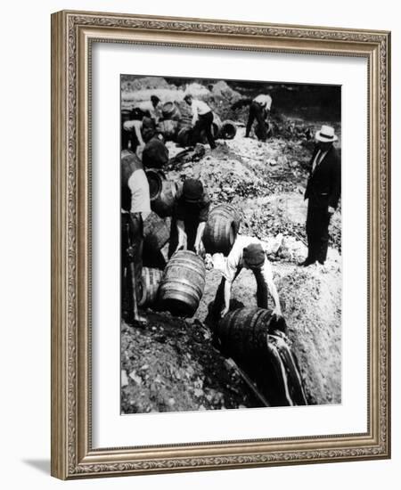 A Us Federal Agent Oversees the Destruction of Beer Kegs During the American Prohibition Era…-American Photographer-Framed Photographic Print