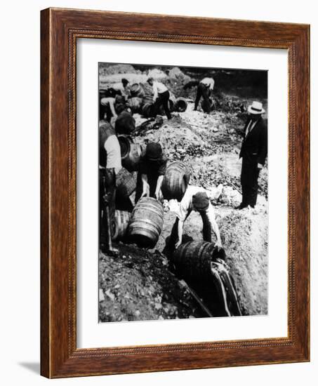 A Us Federal Agent Oversees the Destruction of Beer Kegs During the American Prohibition Era…-American Photographer-Framed Photographic Print