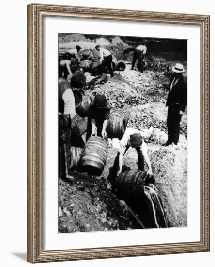 A Us Federal Agent Oversees the Destruction of Beer Kegs During the American Prohibition Era…-American Photographer-Framed Photographic Print