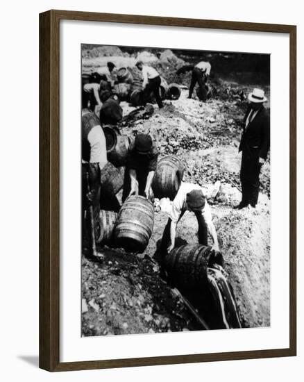 A Us Federal Agent Oversees the Destruction of Beer Kegs During the American Prohibition Era…-American Photographer-Framed Photographic Print