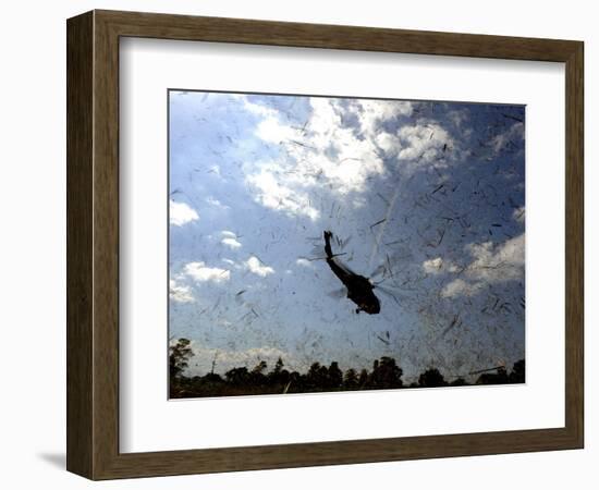 A US Navy Hh-60 Seahawk Stirs Up Debris While Taking Off-null-Framed Photographic Print