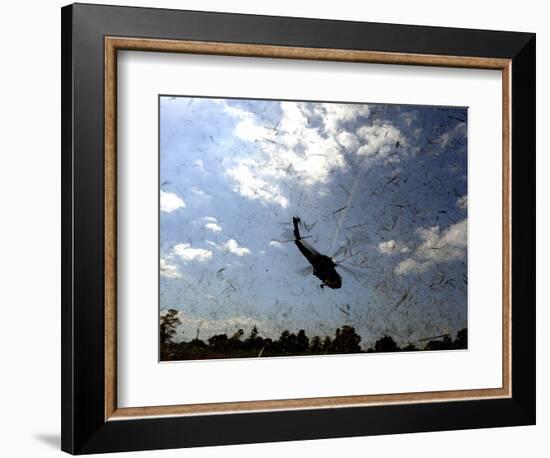 A US Navy Hh-60 Seahawk Stirs Up Debris While Taking Off-null-Framed Photographic Print