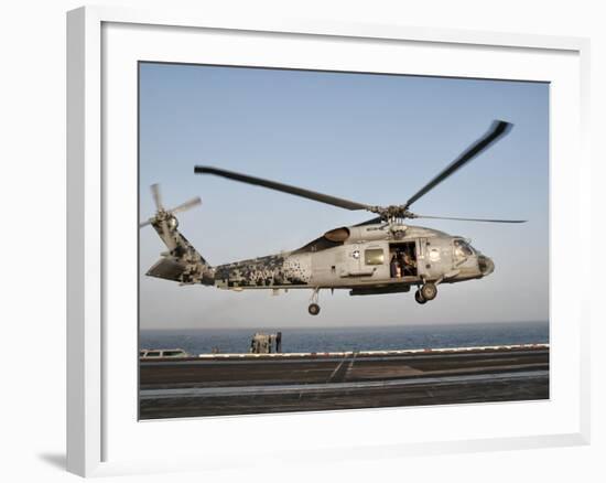 A US Navy SH-60F Seahawk Hovers Above the Flight Deck of USS Eisenhower-Stocktrek Images-Framed Photographic Print