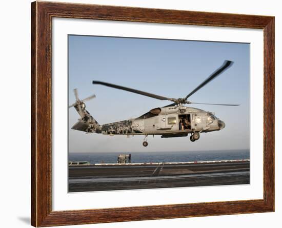 A US Navy SH-60F Seahawk Hovers Above the Flight Deck of USS Eisenhower-Stocktrek Images-Framed Photographic Print