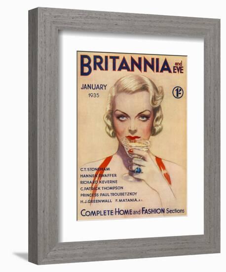 A Vampish Blonde Bombshell Stares Seductively at the Viewer as She Sips a Cocktail-null-Framed Art Print