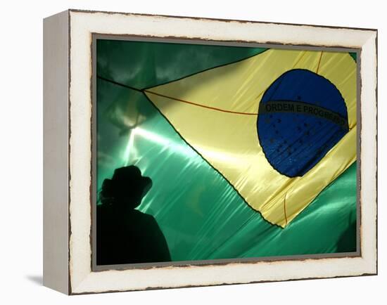 A Vendor Walks Behind a Big Brazilian Flag-null-Framed Premier Image Canvas