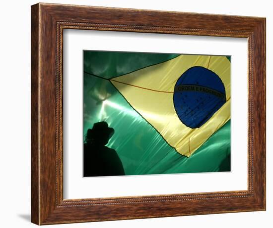 A Vendor Walks Behind a Big Brazilian Flag-null-Framed Photographic Print