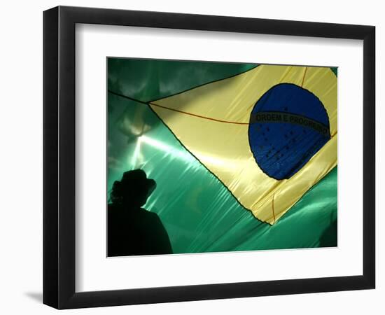 A Vendor Walks Behind a Big Brazilian Flag-null-Framed Photographic Print