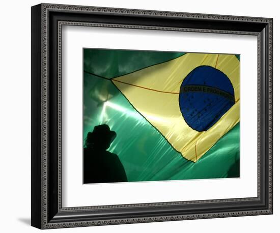 A Vendor Walks Behind a Big Brazilian Flag-null-Framed Photographic Print