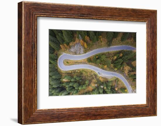 A view by drone of a winding road in the Dolomites, Italy-Julian Elliott-Framed Photographic Print