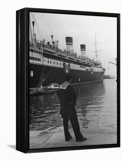 A View of a Sailor Looking at a Ship Docked in the City of Genoa-Carl Mydans-Framed Premier Image Canvas