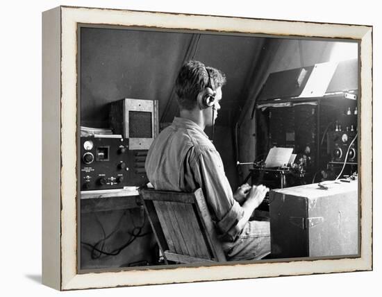 A View of a Soldier Using Communications Equipment During US Army Maneuvers-John Phillips-Framed Premier Image Canvas