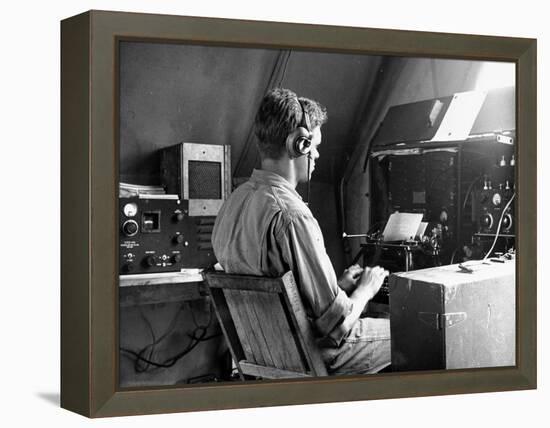 A View of a Soldier Using Communications Equipment During US Army Maneuvers-John Phillips-Framed Premier Image Canvas