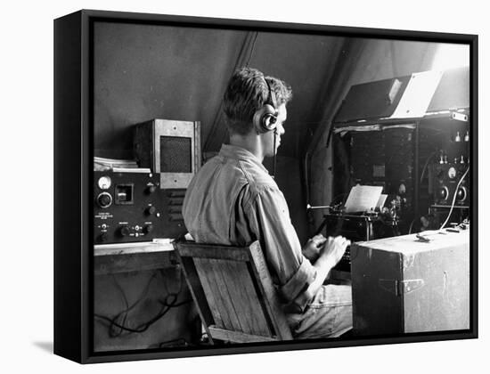 A View of a Soldier Using Communications Equipment During US Army Maneuvers-John Phillips-Framed Premier Image Canvas