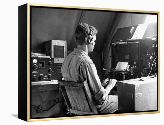 A View of a Soldier Using Communications Equipment During US Army Maneuvers-John Phillips-Framed Premier Image Canvas