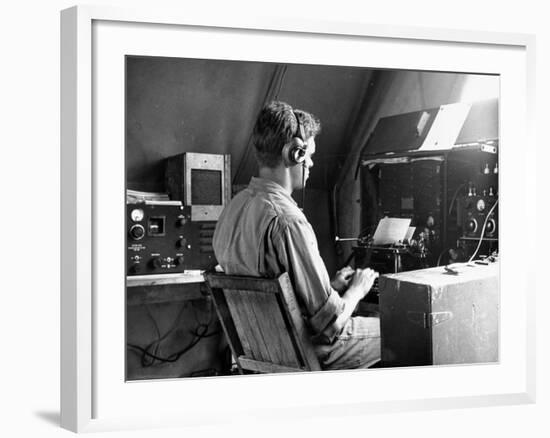 A View of a Soldier Using Communications Equipment During US Army Maneuvers-John Phillips-Framed Premium Photographic Print