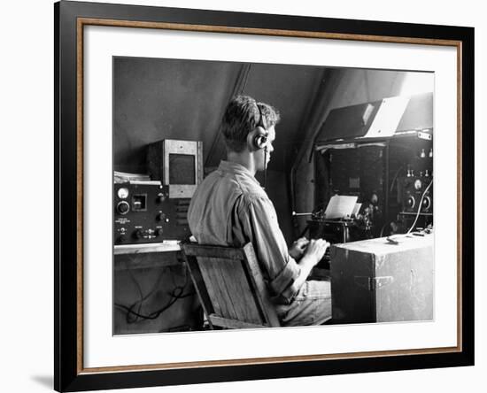 A View of a Soldier Using Communications Equipment During US Army Maneuvers-John Phillips-Framed Premium Photographic Print