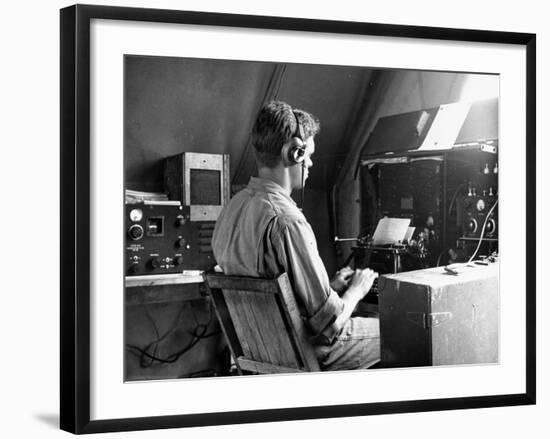 A View of a Soldier Using Communications Equipment During US Army Maneuvers-John Phillips-Framed Premium Photographic Print