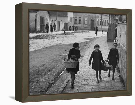 A View of Jewish Children Walking Through the Streets of their Ghetto-William Vandivert-Framed Premier Image Canvas