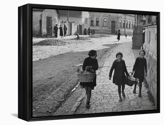 A View of Jewish Children Walking Through the Streets of their Ghetto-William Vandivert-Framed Premier Image Canvas