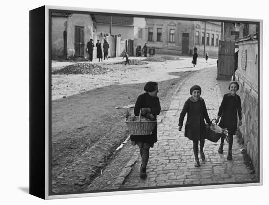 A View of Jewish Children Walking Through the Streets of their Ghetto-William Vandivert-Framed Premier Image Canvas