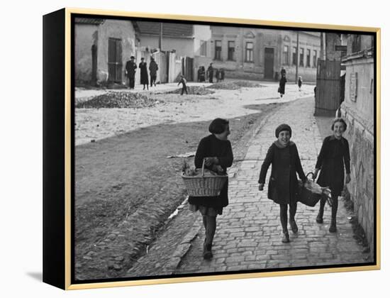 A View of Jewish Children Walking Through the Streets of their Ghetto-William Vandivert-Framed Premier Image Canvas