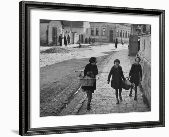 A View of Jewish Children Walking Through the Streets of their Ghetto-William Vandivert-Framed Premium Photographic Print