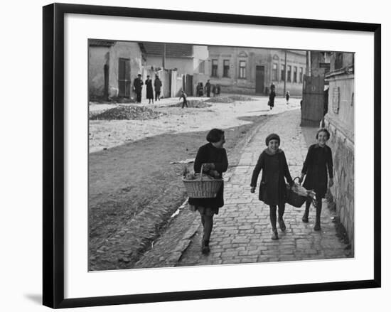 A View of Jewish Children Walking Through the Streets of their Ghetto-William Vandivert-Framed Premium Photographic Print