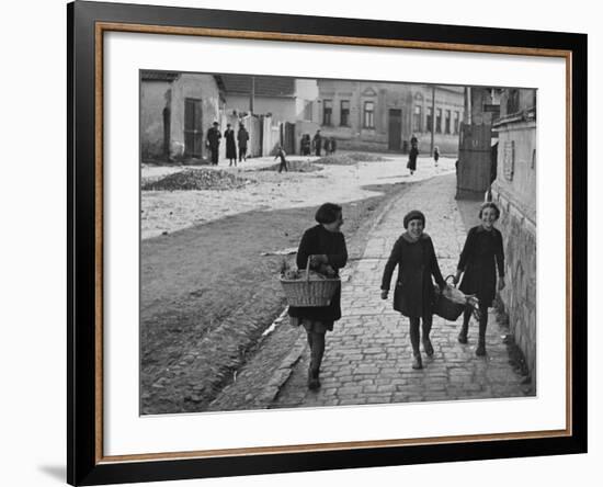 A View of Jewish Children Walking Through the Streets of their Ghetto-William Vandivert-Framed Premium Photographic Print