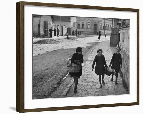 A View of Jewish Children Walking Through the Streets of their Ghetto-William Vandivert-Framed Premium Photographic Print