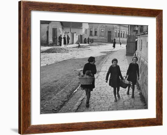 A View of Jewish Children Walking Through the Streets of their Ghetto-William Vandivert-Framed Premium Photographic Print