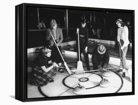 A View of People Playing a New Game Called Curling-George Strock-Framed Premier Image Canvas