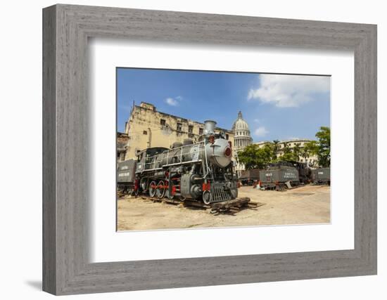 A Vintage Steam Train in a Restoration Yard with Dome of Former Parliament Building in Background-Sean Cooper-Framed Photographic Print