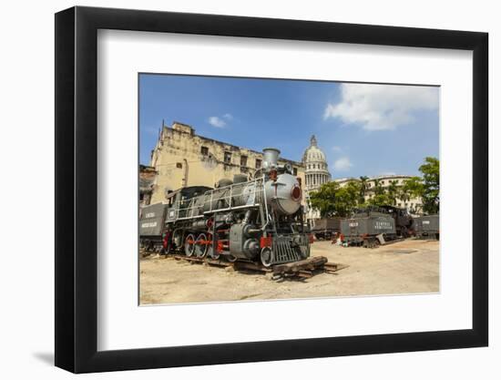 A Vintage Steam Train in a Restoration Yard with Dome of Former Parliament Building in Background-Sean Cooper-Framed Photographic Print