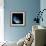 A Water Covered World in Deep Space Illuminated by a it's Parent Star-null-Framed Art Print displayed on a wall