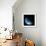 A Water Covered World in Deep Space Illuminated by a it's Parent Star-null-Framed Art Print displayed on a wall
