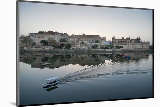 A Water Taxi Passing City Palace Reflected in Still Dawn Waters of Lake Pichola, Rajasthan, India-Martin Child-Mounted Photographic Print