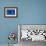 A white cat peeks out a blue door. Chefchaouen, Morocco-Karine Aigner-Framed Photographic Print displayed on a wall