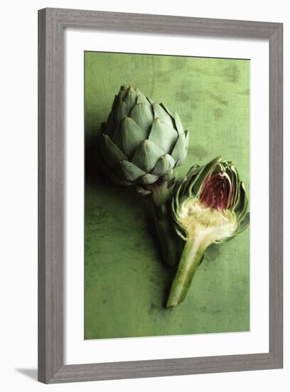 A Whole and a Half Artichoke on Green Background-Studio DHS-Framed Photographic Print
