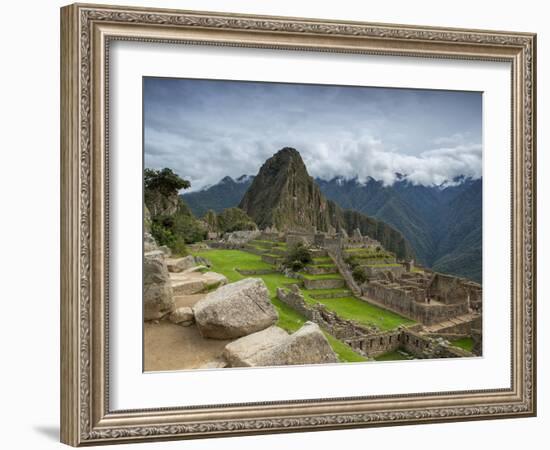 A wide angle photo of Macchu Pichu at sunrise with dramatic clouds in the distance.-Alex Saberi-Framed Photographic Print