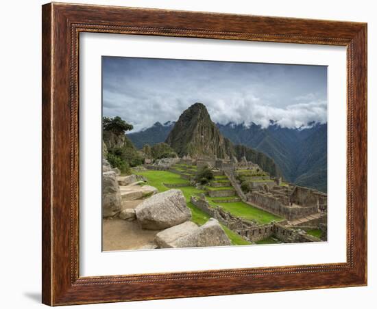 A wide angle photo of Macchu Pichu at sunrise with dramatic clouds in the distance.-Alex Saberi-Framed Photographic Print