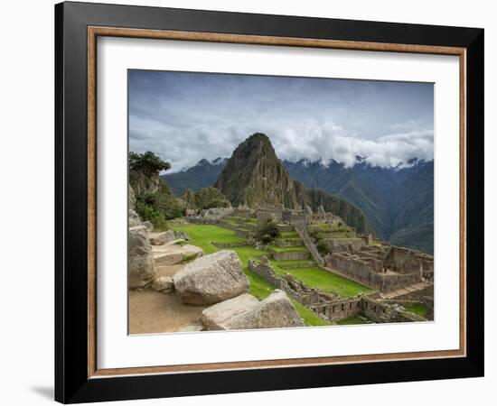 A wide angle photo of Macchu Pichu at sunrise with dramatic clouds in the distance.-Alex Saberi-Framed Photographic Print