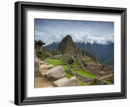 A wide angle photo of Macchu Pichu at sunrise with dramatic clouds in the distance.-Alex Saberi-Framed Photographic Print