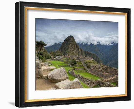 A wide angle photo of Macchu Pichu at sunrise with dramatic clouds in the distance.-Alex Saberi-Framed Photographic Print