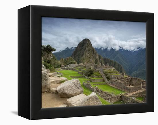 A wide angle photo of Macchu Pichu at sunrise with dramatic clouds in the distance.-Alex Saberi-Framed Premier Image Canvas