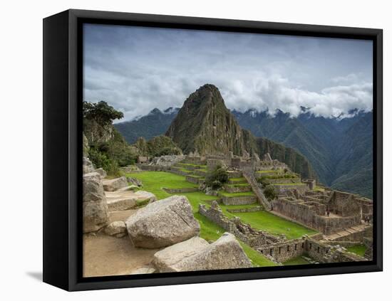 A wide angle photo of Macchu Pichu at sunrise with dramatic clouds in the distance.-Alex Saberi-Framed Premier Image Canvas