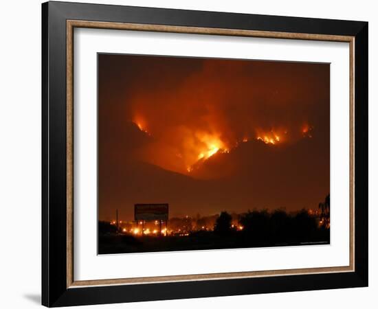 A Wildfire Can be Seen Raging in the Hills Over the Town of St. Ignatius, Montana-null-Framed Photographic Print