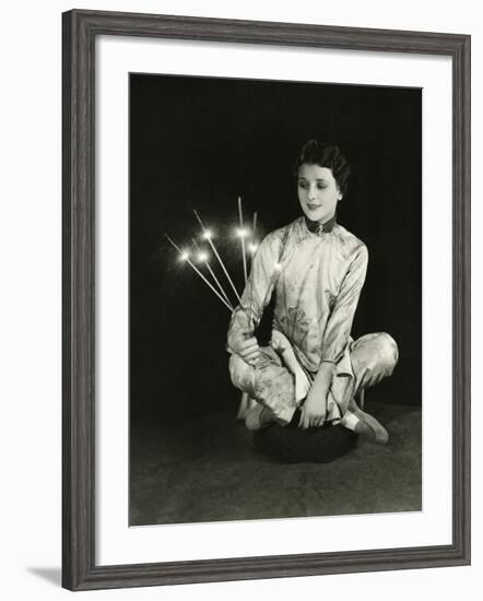 A Woman Holds Sparklers-null-Framed Photo