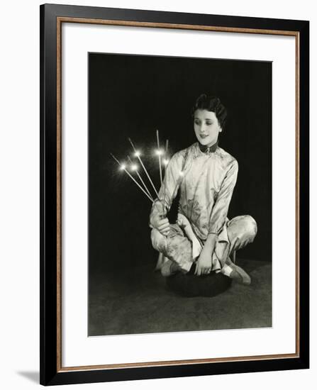 A Woman Holds Sparklers-null-Framed Photo