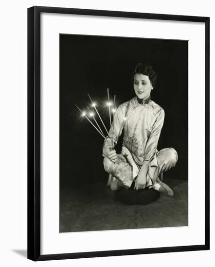 A Woman Holds Sparklers-null-Framed Photo